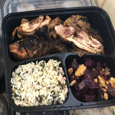 Jerk Chicken served with Spinach Rice and Beet Salad